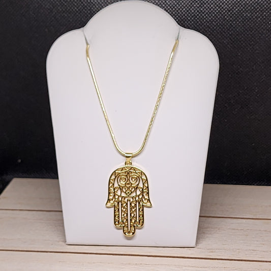 Hamsa protección dorada necklace